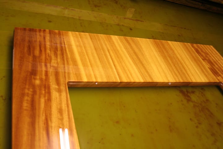 Corner detail of an oiled iroko worktop with rectangular cutout