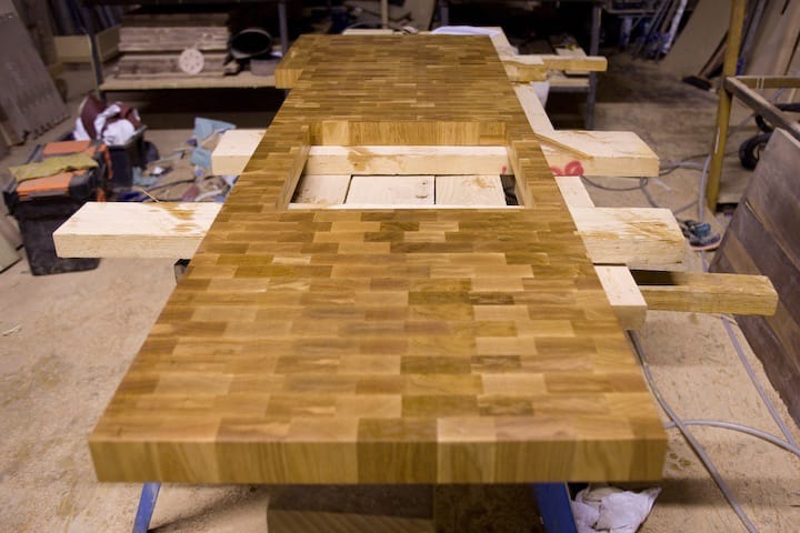 Long end grain oak worktop with hob cut-out under construction in the workshop