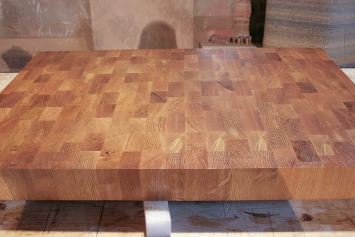 Oiled end grain oak butcher's block showing chequerboard grain pattern