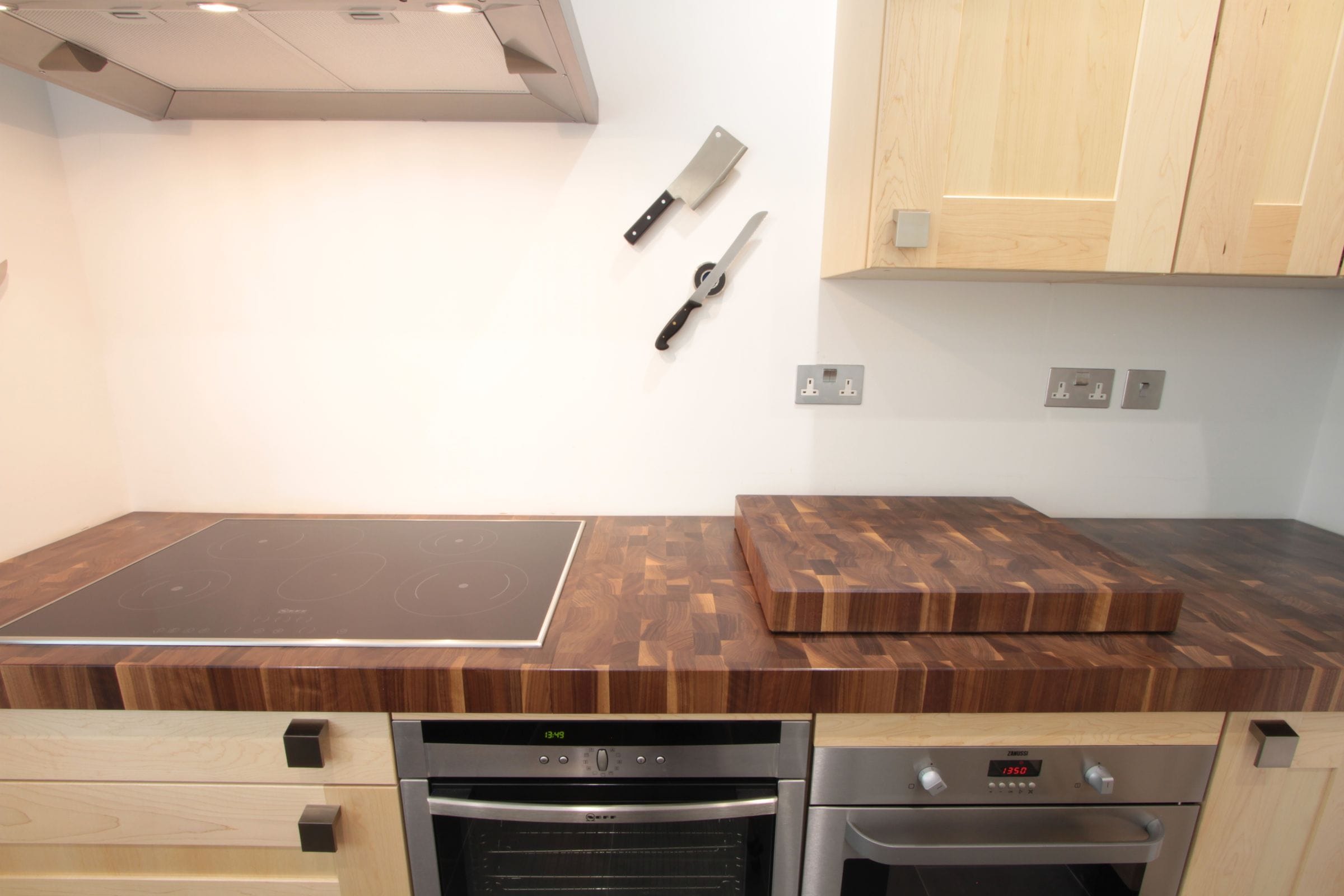 Maple kitchen with walnut end grain worktop, matching chopping block and hob