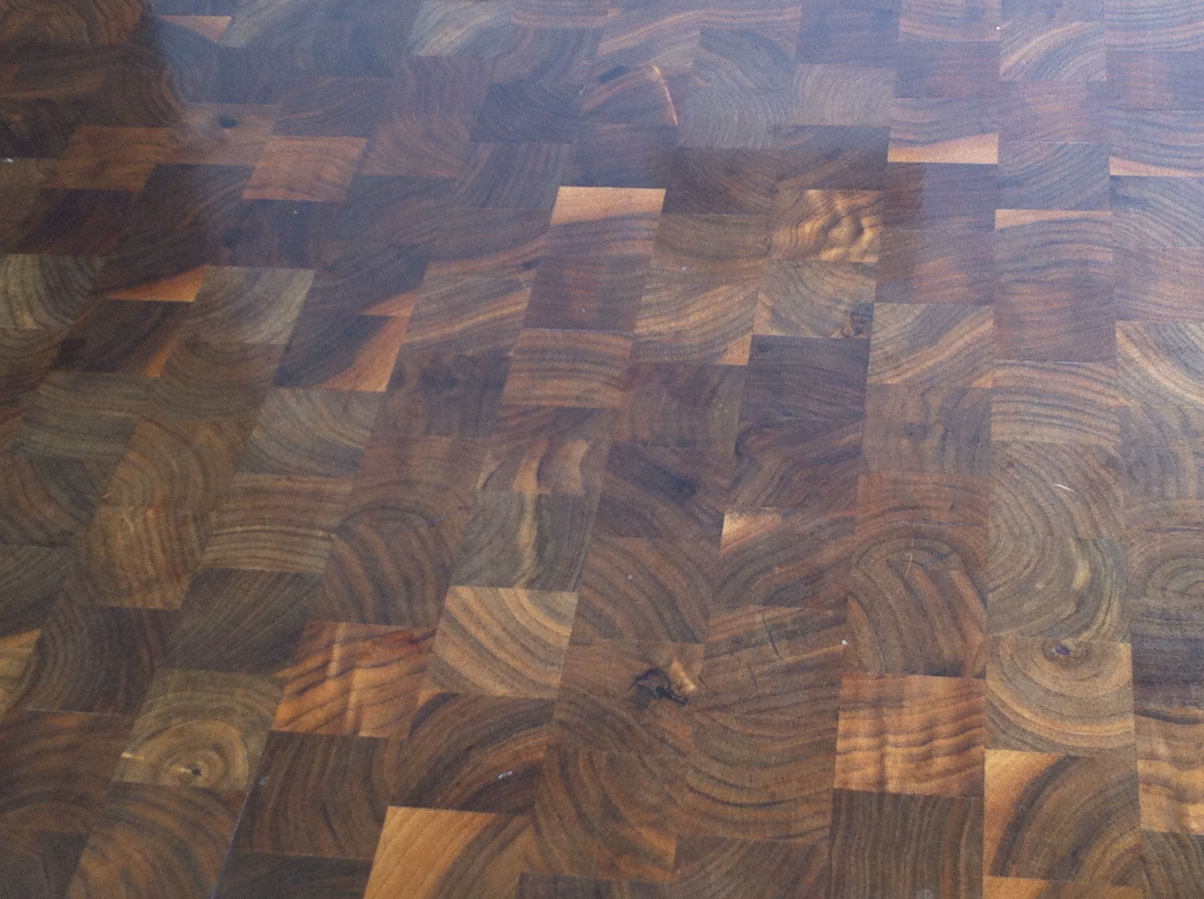 Close-up of oiled walnut end grain showing swirling growth rings