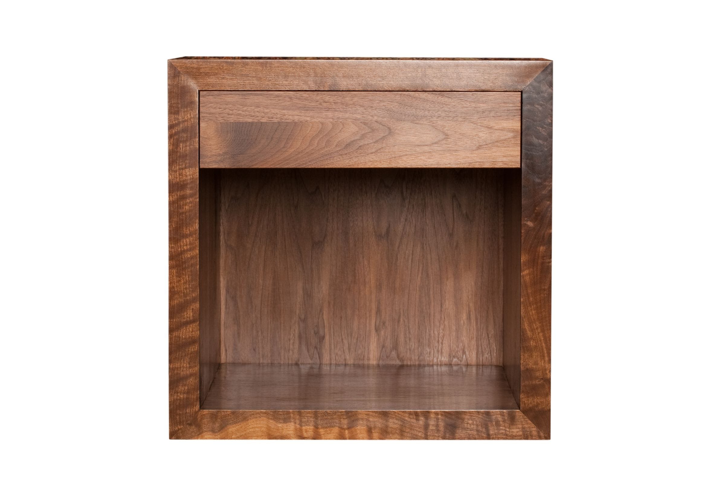 Cube-shaped walnut bedside table with single drawer and open shelf, front view