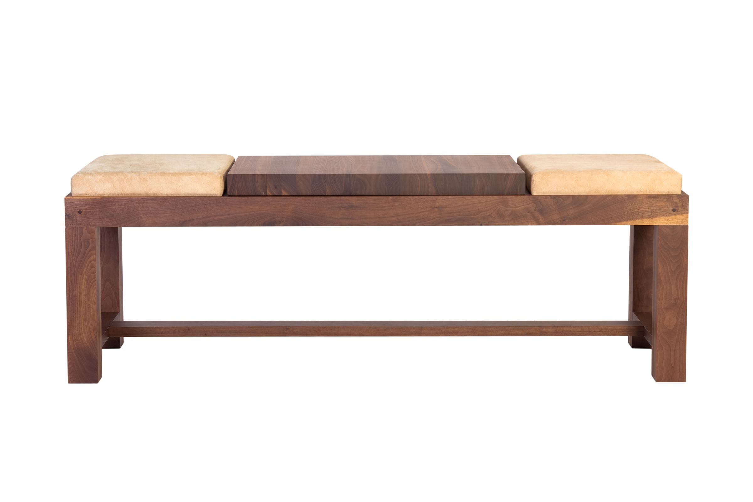 Walnut bench with two suede seat cushions flanking a solid walnut centre section