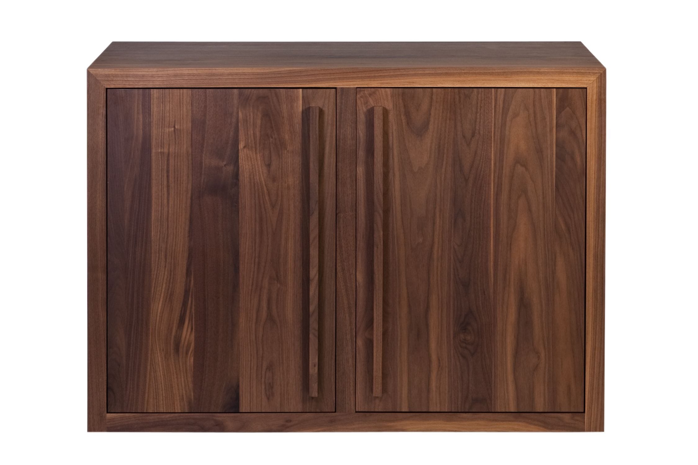 Two-door walnut cabinet with long recessed handles and rich grain, front view