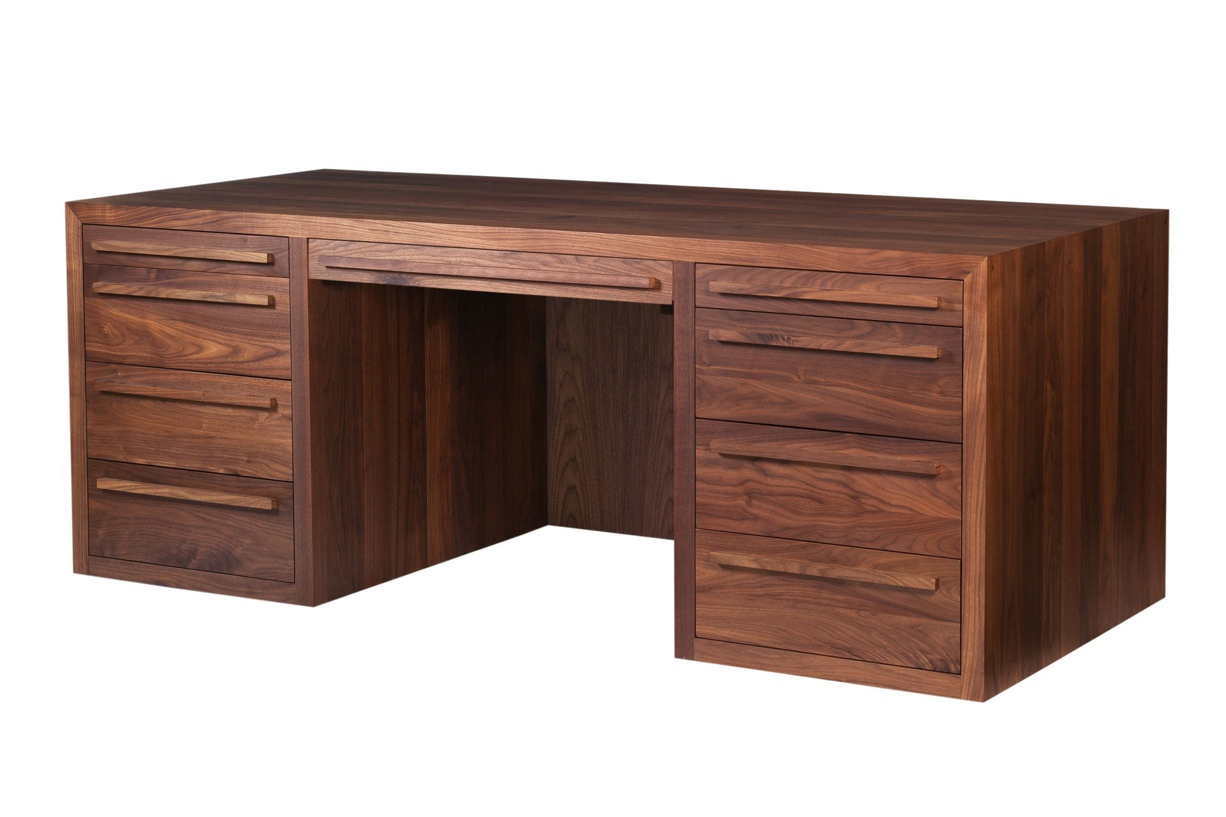 Solid walnut pedestal desk with drawers either side of the kneehole, angled view