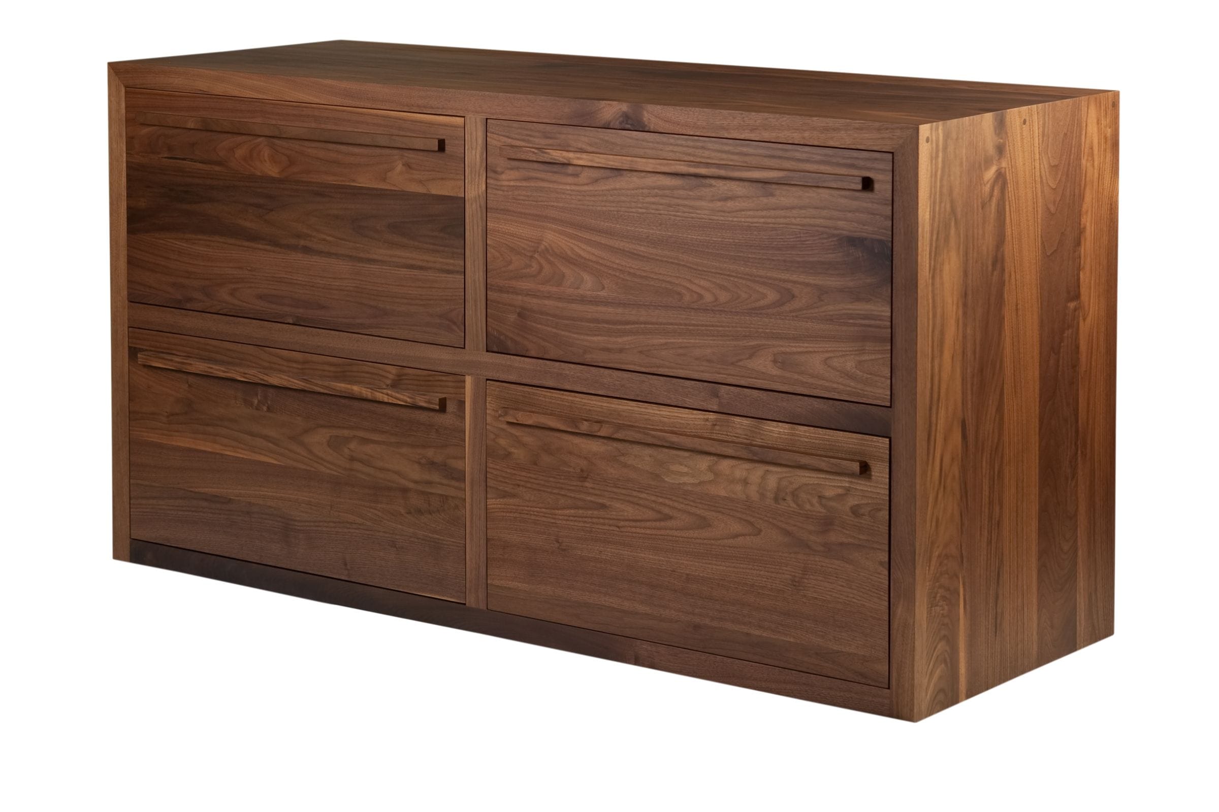 Low four-drawer walnut chest viewed from an angle showing swirling grain