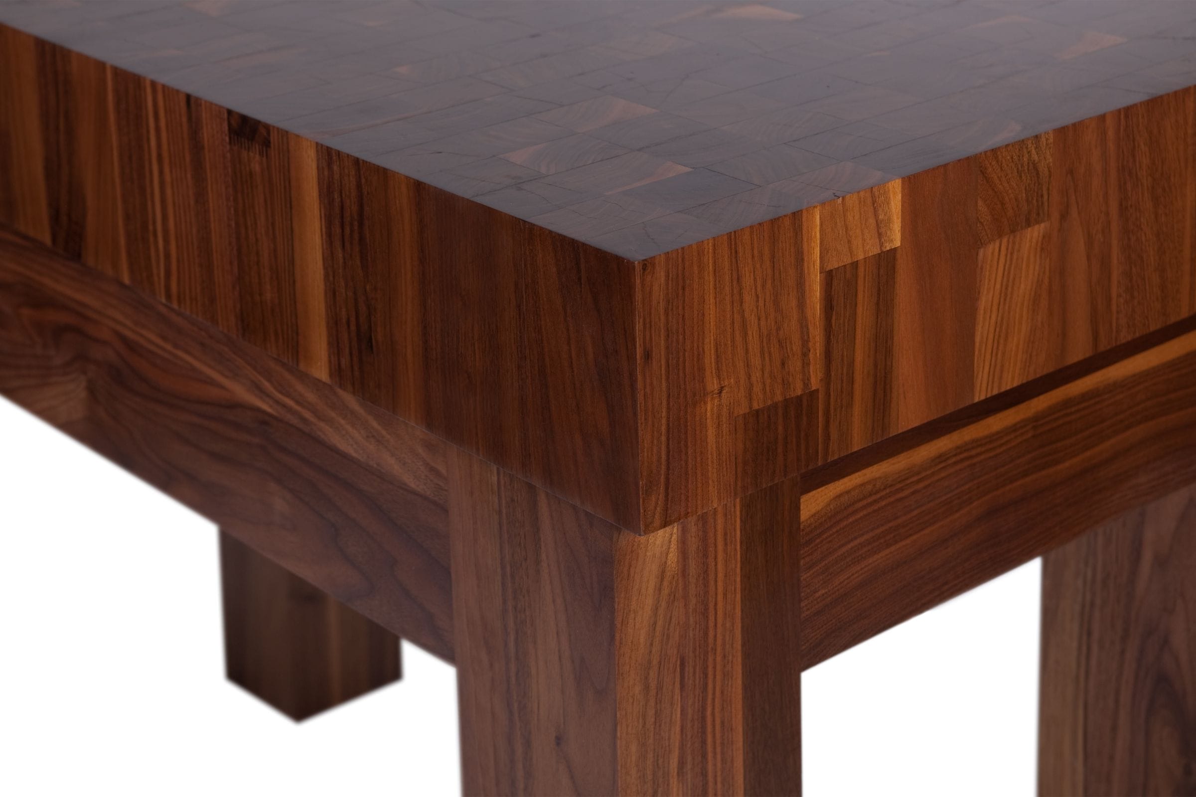 Corner detail of an end-grain walnut butcher's block showing chequered pattern