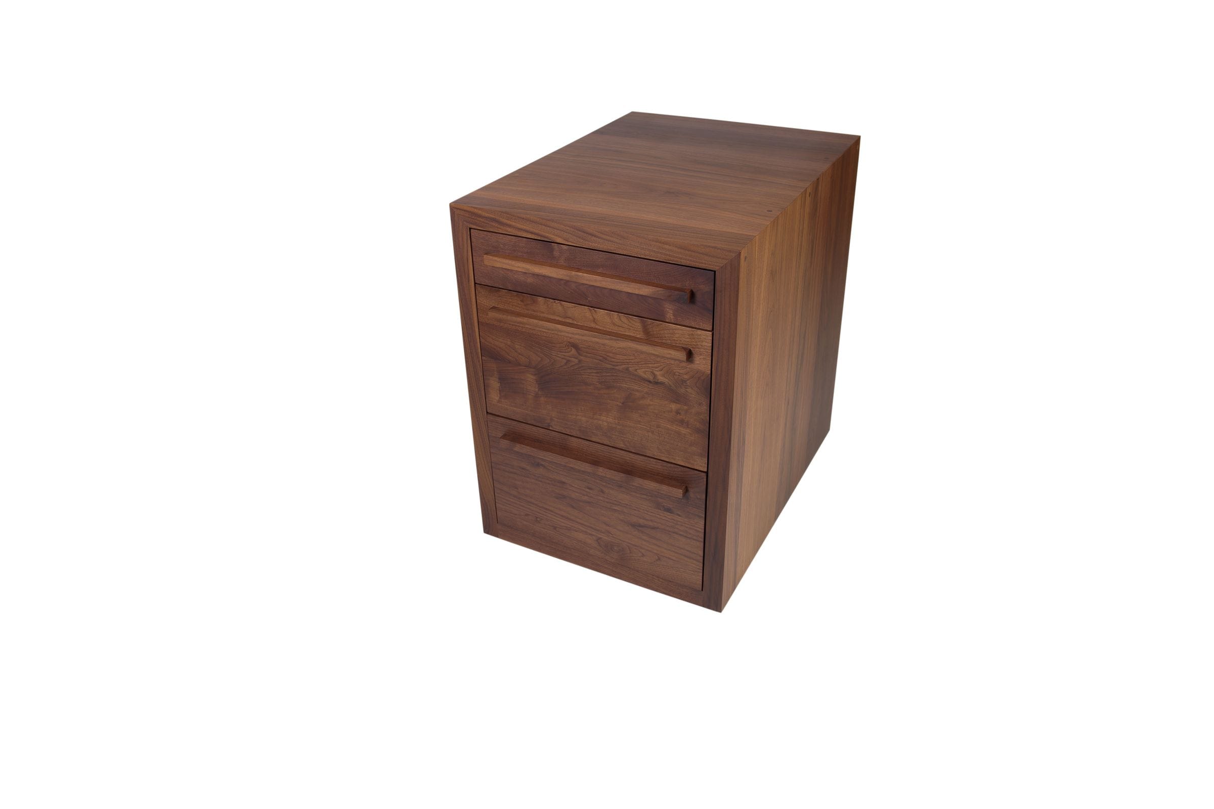Angled view of a walnut three-drawer pedestal cabinet with slim wooden handles