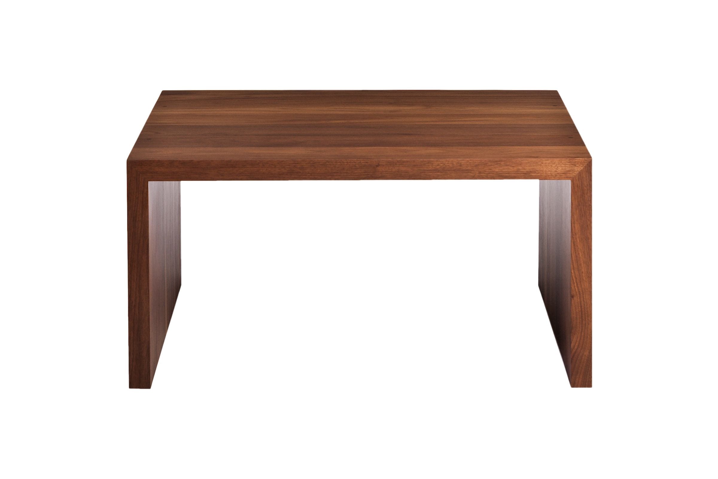 Front view of a solid walnut waterfall coffee table with mitred edges