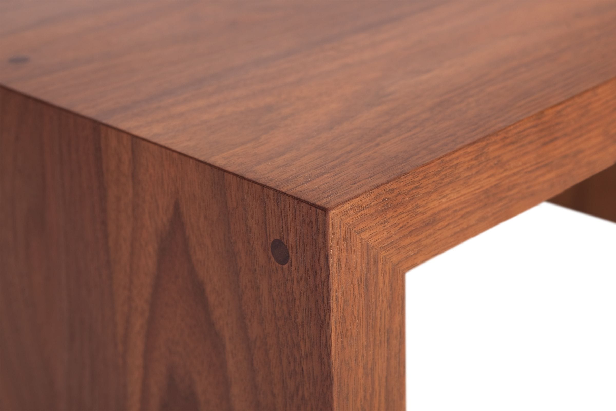 Close-up of a mitred corner joint on a solid walnut table