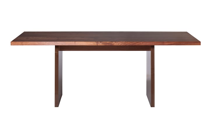 Solid walnut dining table with slab panel legs and slender overhanging top