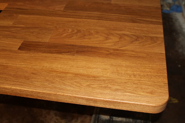 Oiled oak worktop corner showing rounded edge profile and rich grain