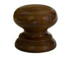 Hand-turned dark wooden cabinet knob with rounded profile