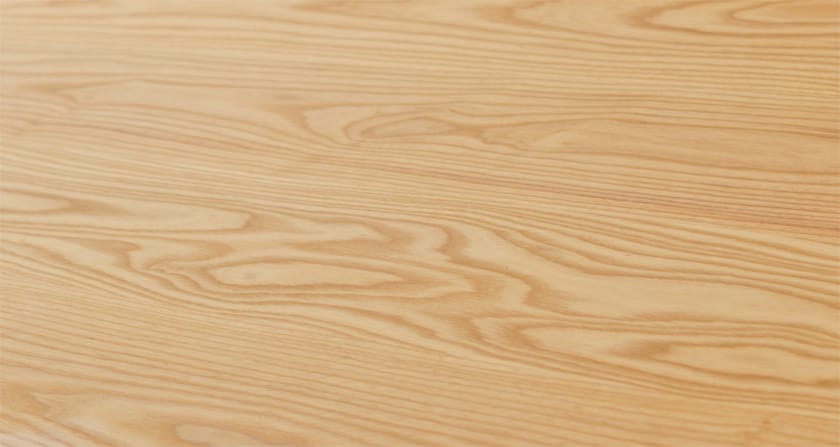 Close-up of an ash worktop surface showing pale swirling grain