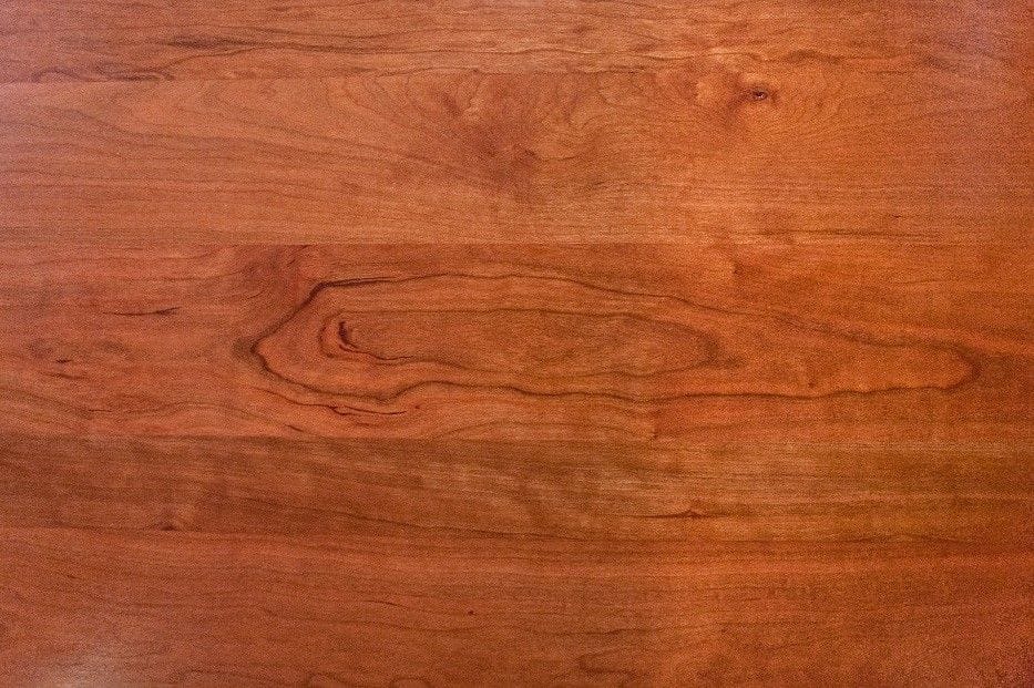 Rich reddish-brown grain of a cherry worktop in close-up