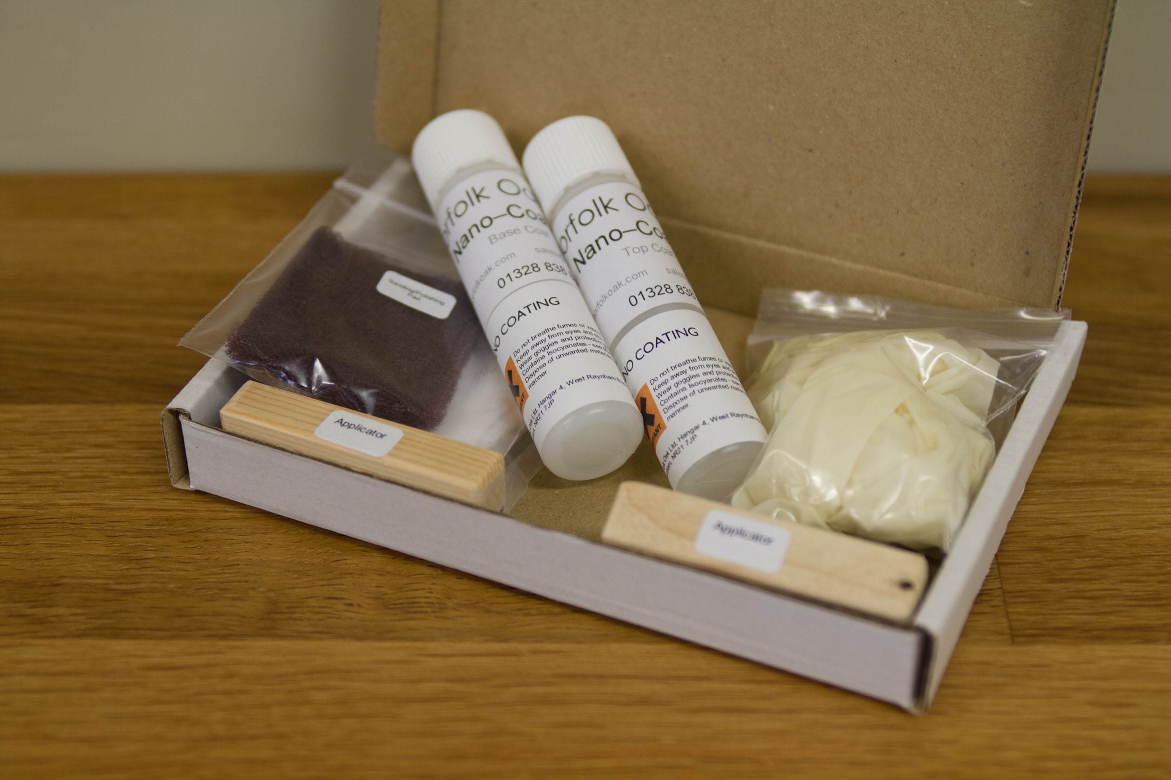 Norfolk Oak nano-coating kit with base and top coat bottles, applicators and gloves