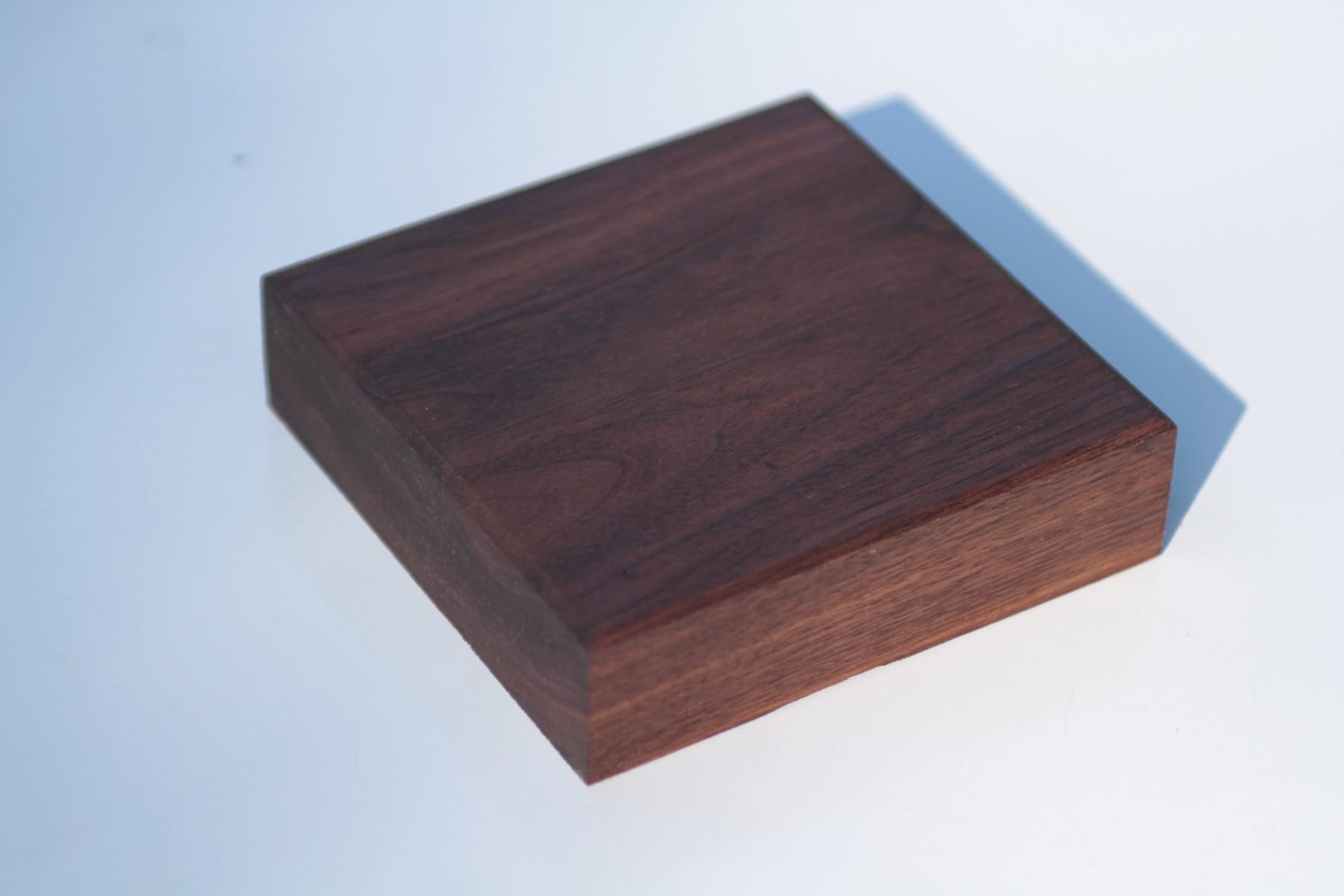 Dark walnut worktop sample block on a plain white background