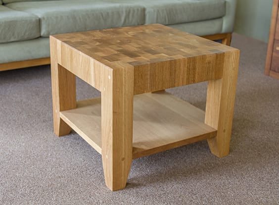 Oak coffee table with chequered end grain top and lower shelf