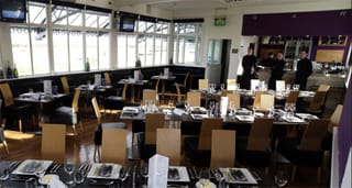 Restaurant dining room with laid tables at Musselburgh Racecourse