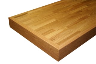 Solid oak stave worktop corner showing finger-jointed grain