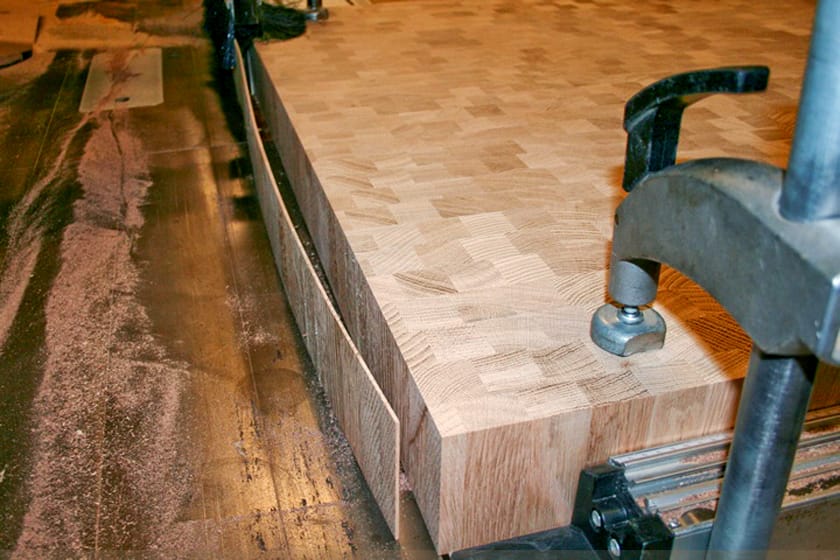 End grain oak worktop clamped on the workbench during manufacture