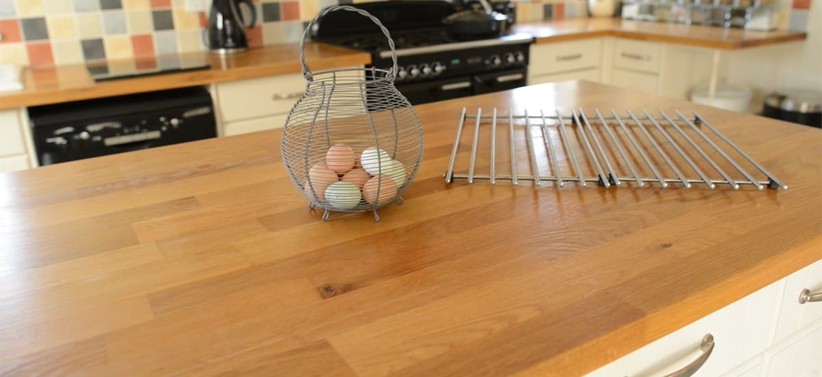 Oak classic wide block island worktop with a wire egg basket and cooling rack