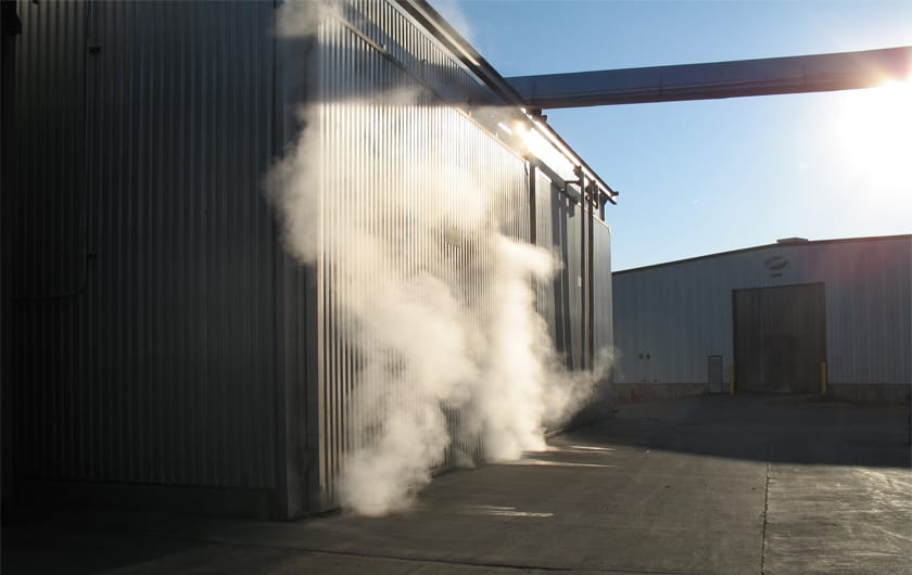 Steam rising from the timber drying kiln at the Norfolk Oak yard
