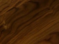 Close-up of dark walnut worktop with swirling grain