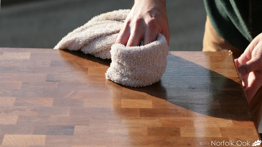 Buffing an oiled end grain board with a soft cloth