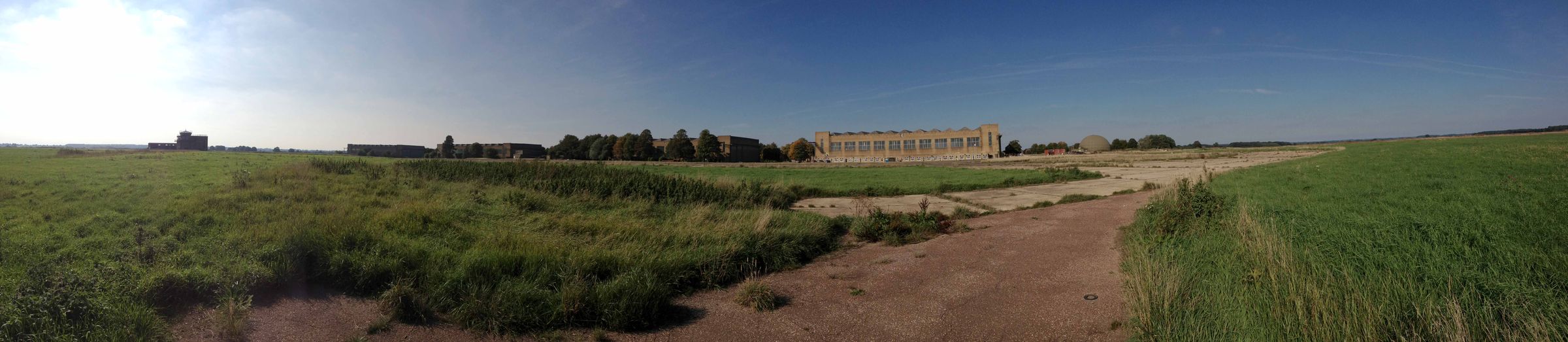 Panoramic view of the disused RAF West Raynham airfield with hangars and control tower
