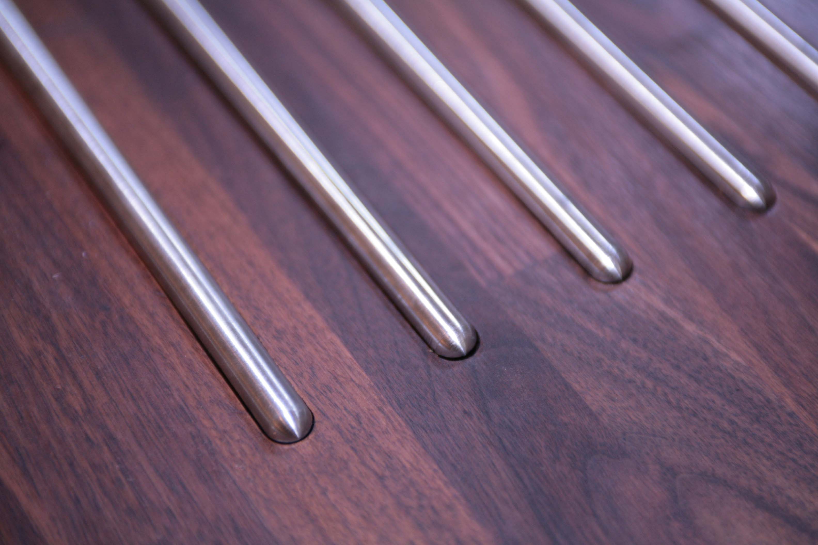 hot-rods Stainless steel hot rods set flush into a dark walnut worktop