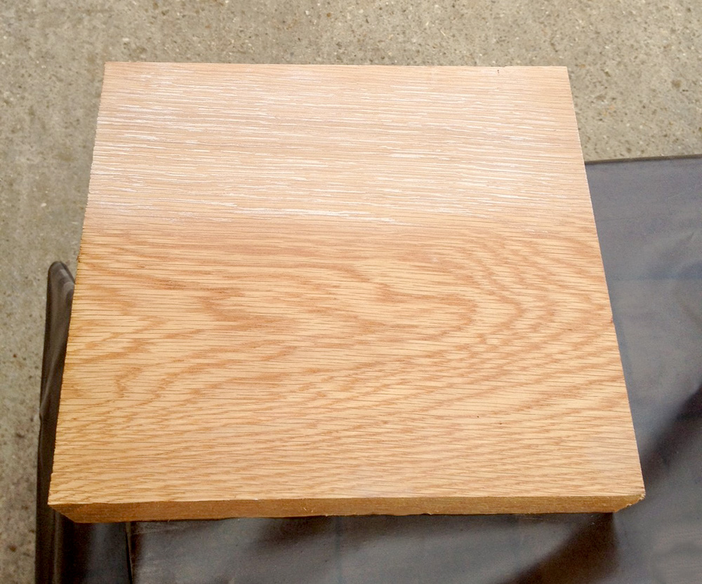 pre-dipped limed sample Square oak sample board with whitewash applied to the top half, bare timber below