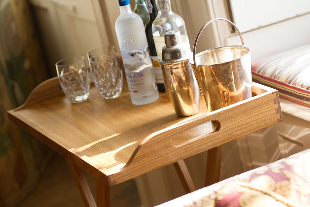 butlers tray with cocktail Oak butler's tray on folding stand set with cocktail shaker, ice bucket and glasses