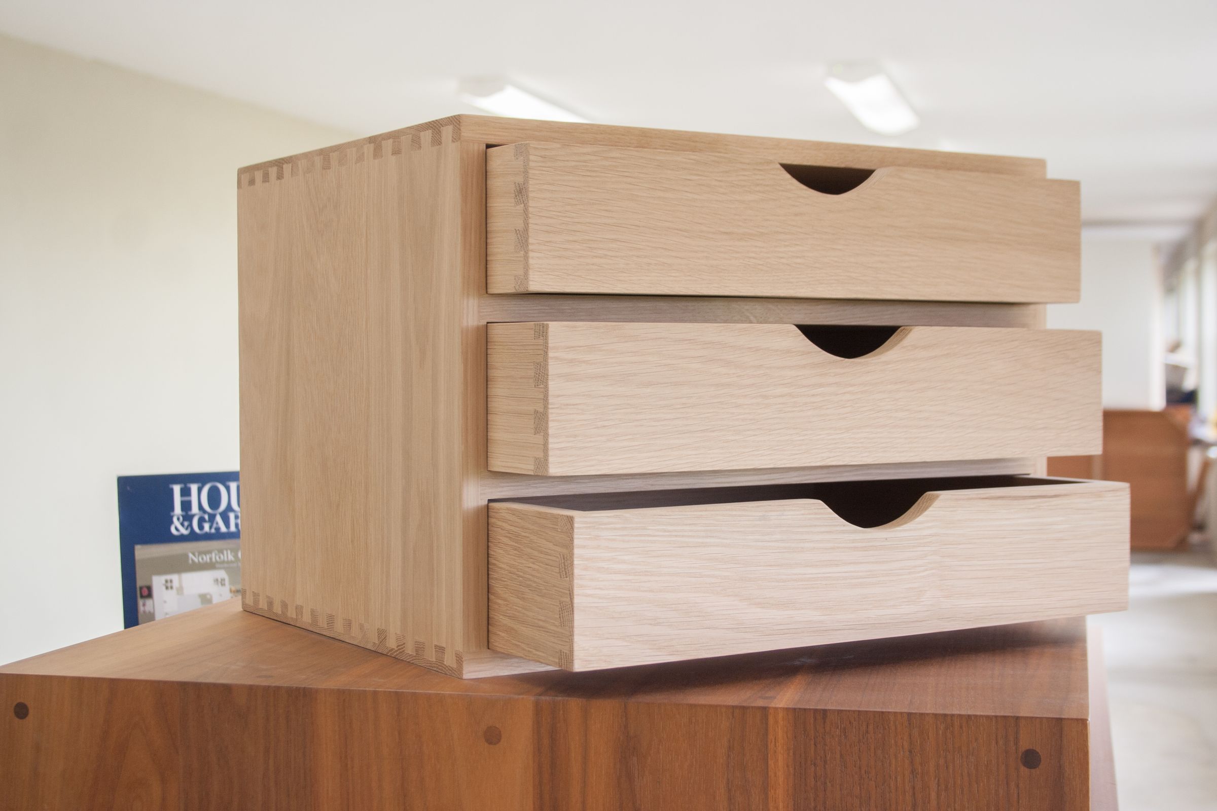oak filing box Dovetailed oak filing box with three drawers pulled open at staggered depths