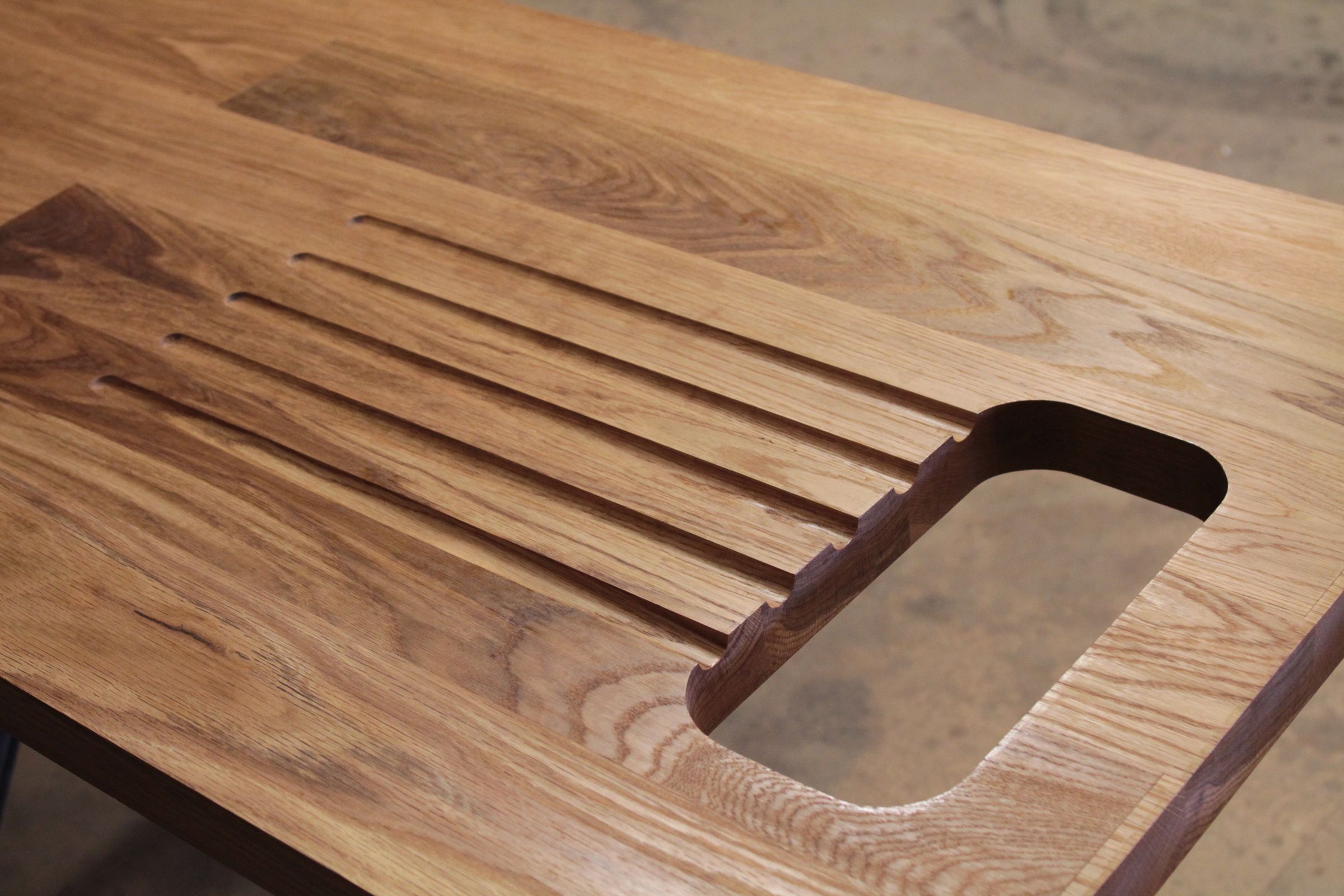 bespoke worktop work Oiled oak worktop with routed drainage grooves and a sink cut-out