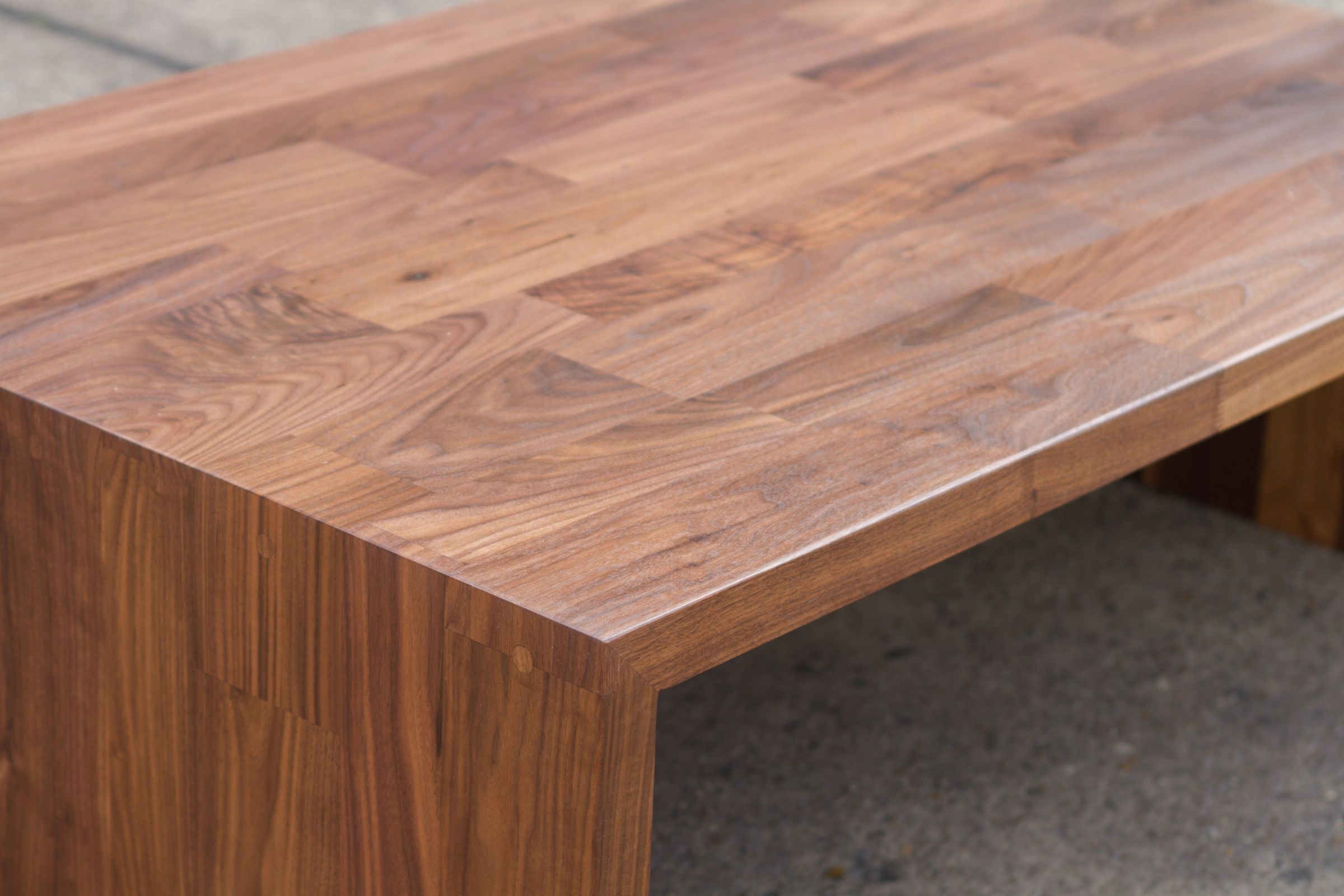 large walnut coffee table grain Close-up of the rich grain across a solid walnut coffee table top